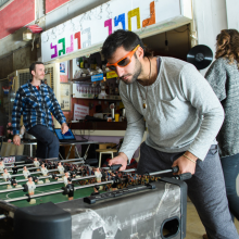 Guy playing foosball